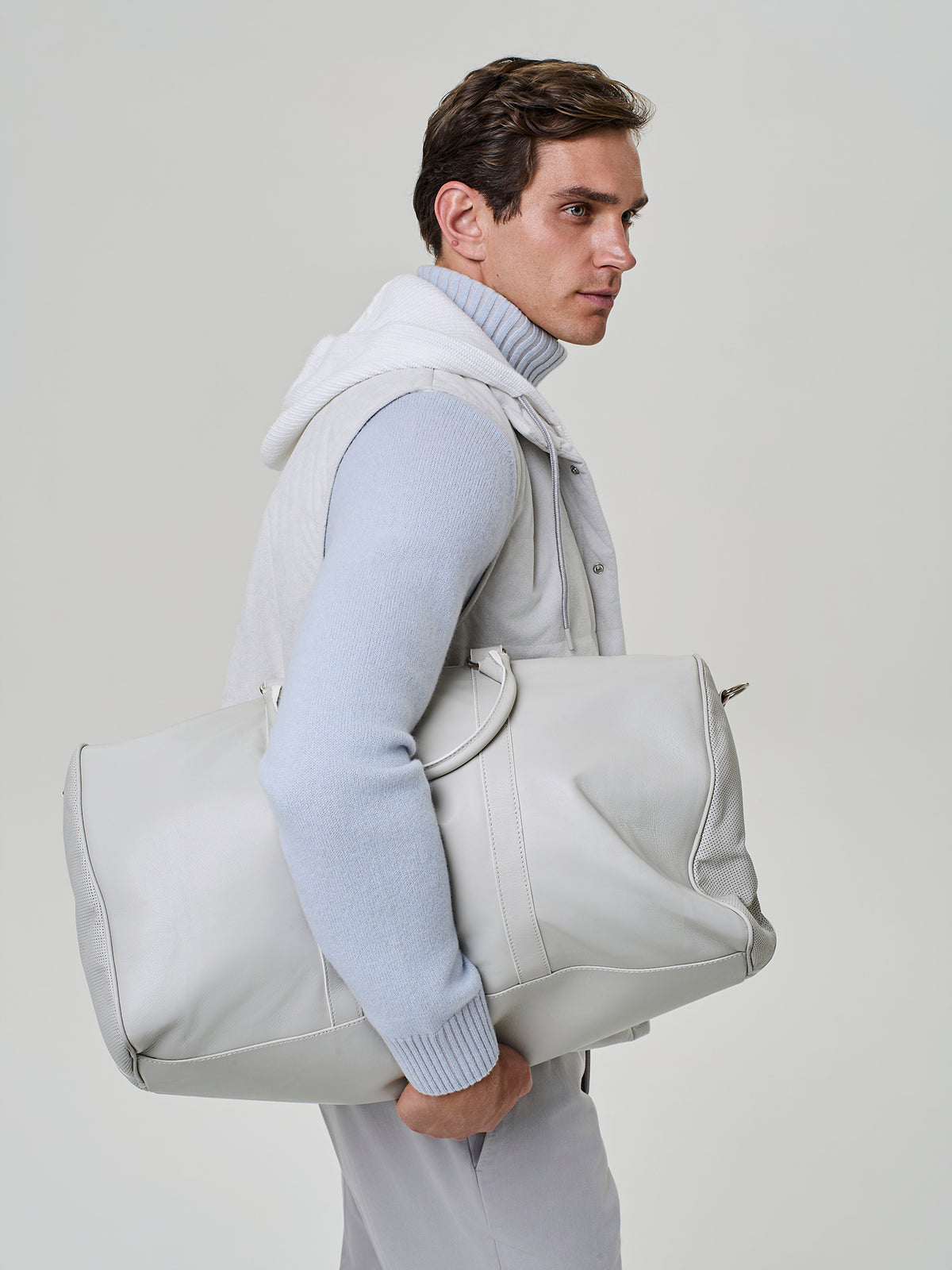 Light beige perforated calfskin duffle bag